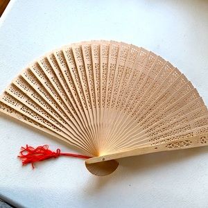 New in Box.  Wooden hand fan